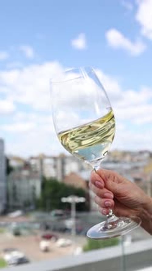 a glass of white wine in a restaurant