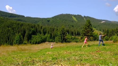 Family Flying a Kite Selective Focus