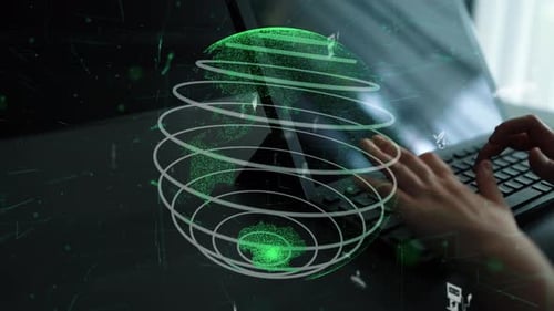 Typing on Laptop with Earth Globe Overlay Graphics