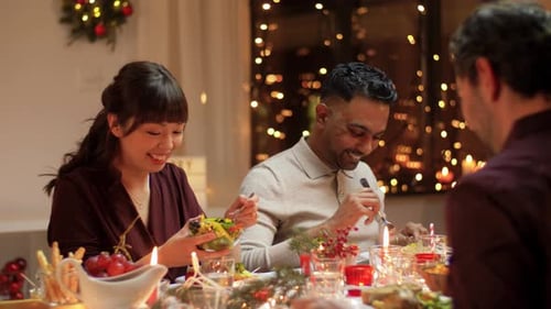 Friends gather for festive Christmas dinner party