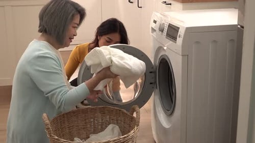 Women Doing Laundry Together at Home