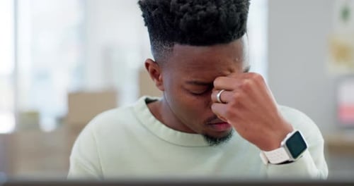 Man, student headache and stress on laptop for online education, e learning and college debt