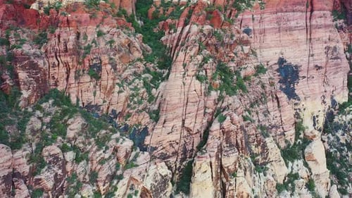 Cinematic zoom-out shot of a natural multicolored mountain strip with beautiful contrasting colors.