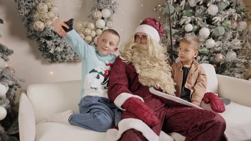 Santa Claus Taking Selfie with Children at Christmas