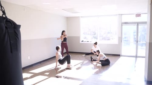 Teenage Girls Stretching In Sunny Exercise Class Studio Slow Motion