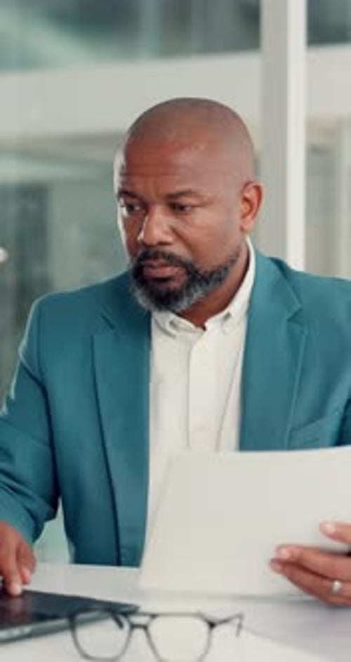 Office, paperwork and man with laptop, typing and data entry with info, financial analysis