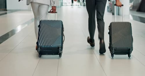 Business people, legs and suitcase at airport with running, terminal or rush in hallway on corporate