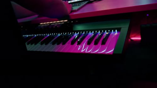 professional sound recording studio sound engineer or music producer sitting at the remote control