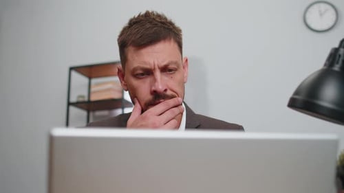 Closeup Businessman Freelancer at Office Workplace Working on Laptop Computer Sends Online Messages