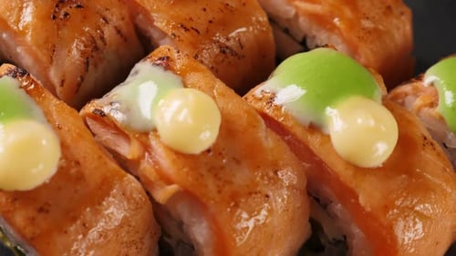 Sushi Rolls on Black Platter Closeup Japanese Cuisine