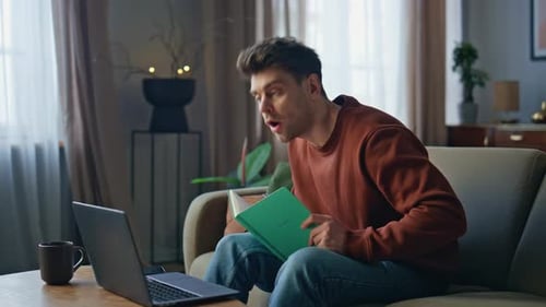Manager Talking Video Conference Looking Laptop Web Camera on Home Couch