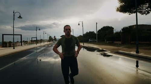 Athlete Running In The Rain