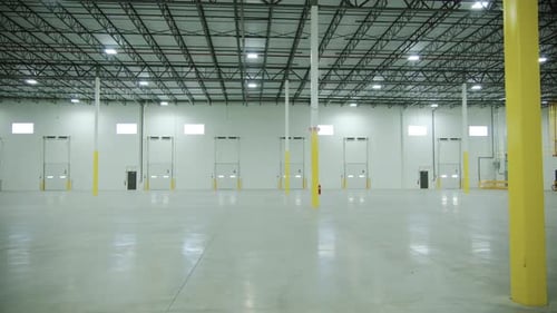 Wide Shot of Inside Large Commercial Warehouse Entrance Gate
