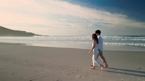 Tourist Couple Holding Hands While Walking On A Summer Beach In Praia de Caion, Spain. Tracking Shot
