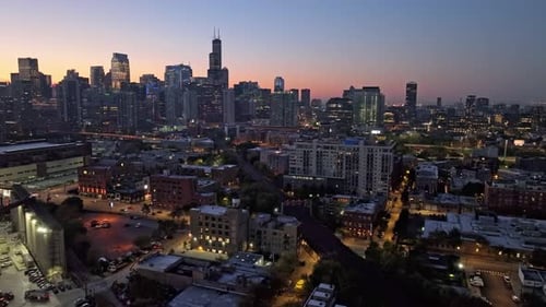 Aerial view over the cityscape and railway of River West, dusk in Chicago, USA