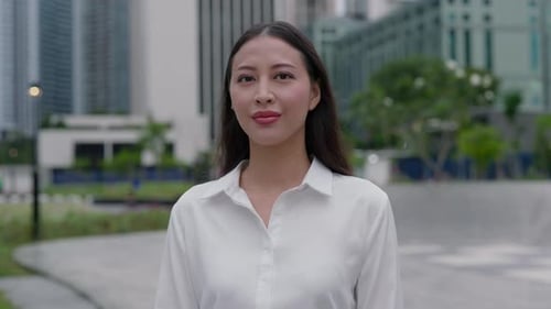 Portrait of the Young Realtor Woman Standing on the Street and Posing to Camera