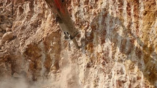 Rock Breaking Machine Working on Construction Site