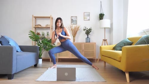 Woman Doing Stretching Workout at Home