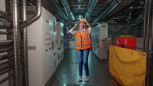 Full Body Of Asian Female Engineer Screaming Goal And Dancing Celebrating In Engine Control Room