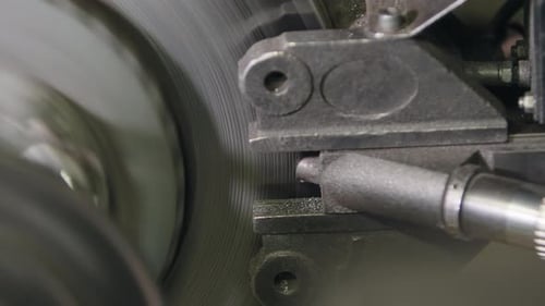 Detailed View of a Wheel with a Rim Notched Into Teeth