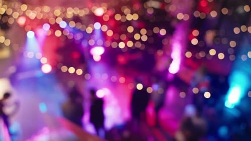 People in Blurred Urban Party at Night