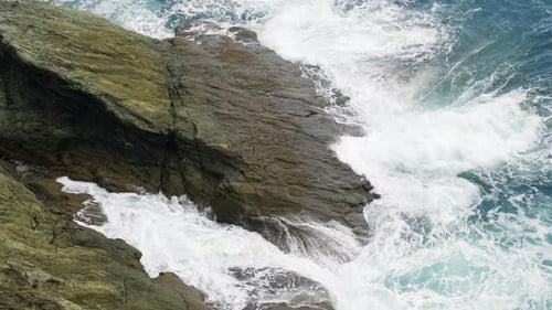 Big Waves Crashing Against A Rocky Shoreline Slow Motion Water In Motion
