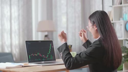 Excited Woman Watching Stock Chart Rise on Computer