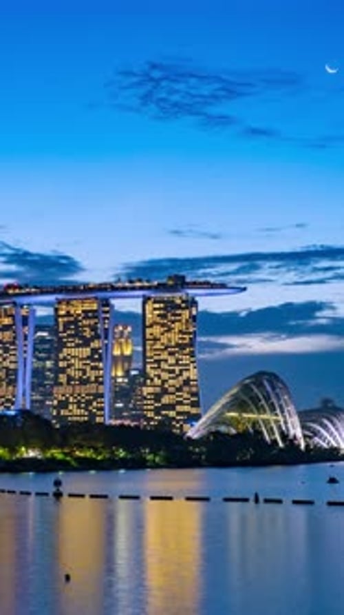 Singapore Central Business District seen from Marina barrage transform from dusk to night.