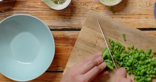 Vertical Flat Lay Video the Cook Cuts Raw Green Beans on the Wooden Board