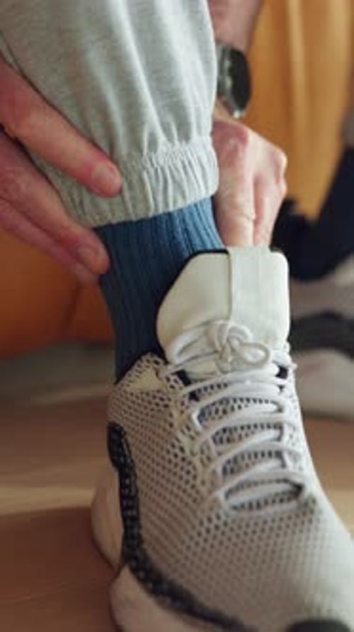 Man Secures Shoe for Fitness and Well-being