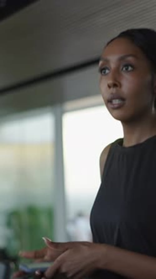 Young Black Woman Having a Call While Walking in a Treadmill in a Condo Gym at Bangkok Lifestyle