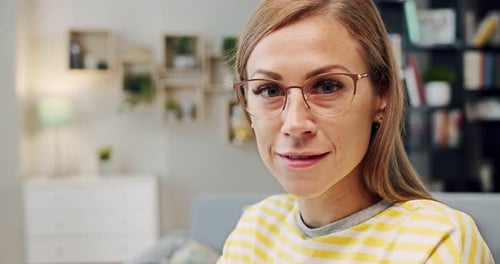 Close Up of Face of Young Caucasian Blonde Beautiful Woman in Glasses Looking at Camera and Smiling