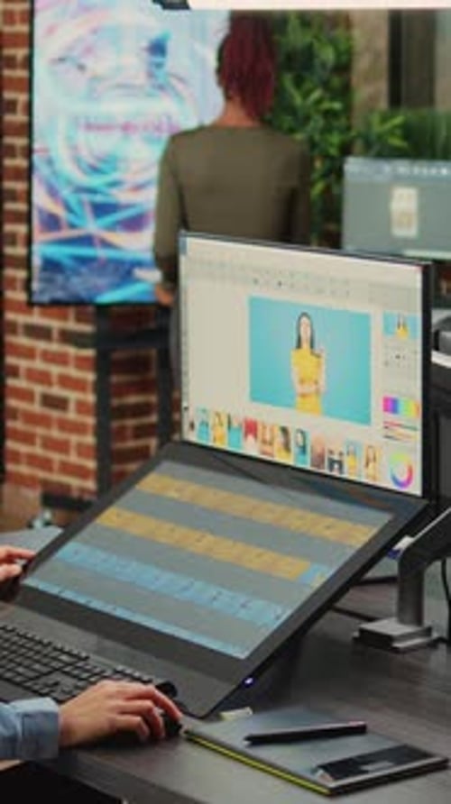 Designer Using Graphics Tablet for Photo Editing