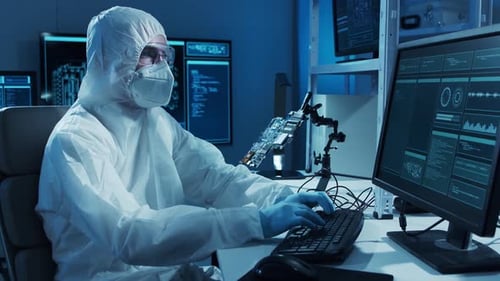 Microelectronics Engineer Works in a Modern Scientific Laboratory on Computing Systems and