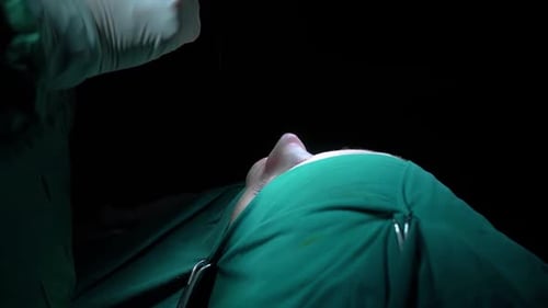 Rhinoplasty procedure and stitching doctor, end of operation.. Rhinoplasty procedure performed by a