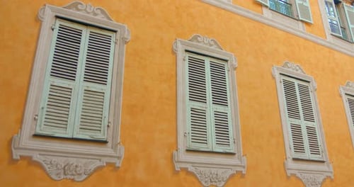 Architecture Facade With Trompe-l'oeil Shuttered Windows In Menton, France. Static Shot