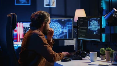 Teleworking IT Employee Runs AI Script on Computer From Home Office