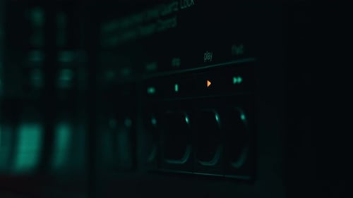 Man Pressing Stop Button on Retro Tape Machine in Studio Closeup Index Touching