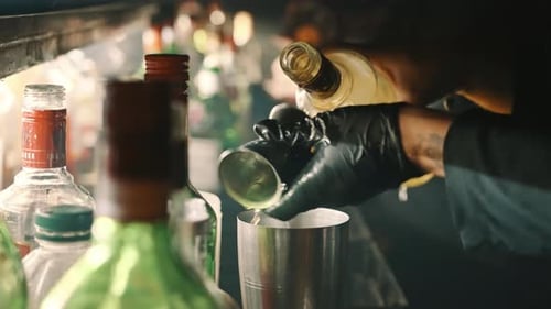 Barman preparing a drink at a bar