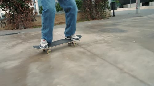 Young Skater Making 360 Flip Jump Performing Kickflip Trick Skateboarder Training in Skatepark