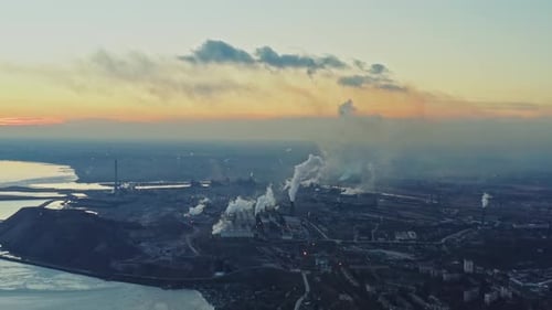 Metallurgical Plant on the Coast of the Winter Sea Top View of the Factory Smoke Rising From the