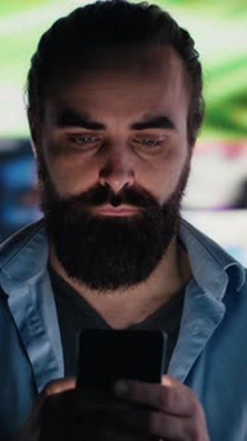 Vertical Video Young Adult Wasting Away in Front of the Phone Screen Due to Social Media Abuse