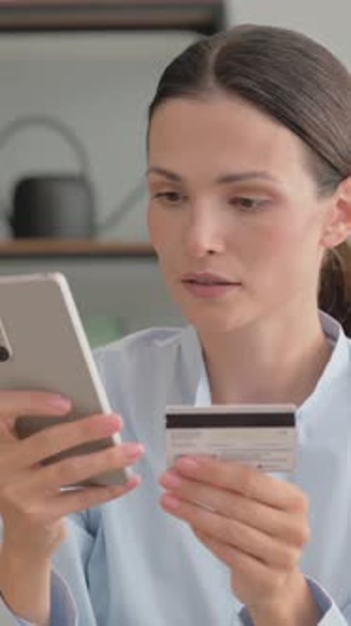 Excited Woman Enjoying Online Shopping with Bank Card Outdoor