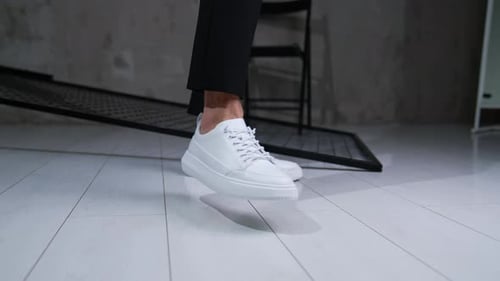 Male footwear demonstration in studio.