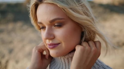 Woman Smiling in the Wind on Beach