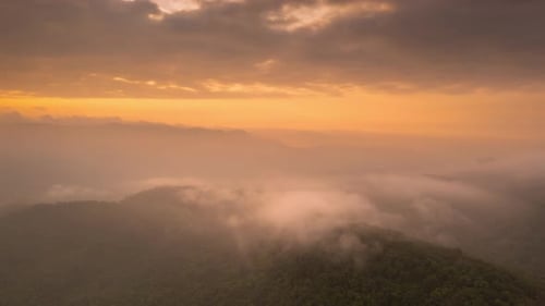 Aerial view morning scenery Mist flowing over the high mountains The movement.