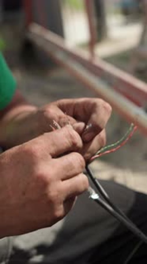 Man Working With Electrical Wires Close Up