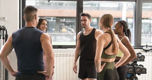 Content Young Fit Multiethnic People Talking in Gym After Workout