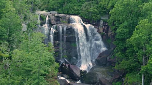 Beautiful Landscape of High Waterfall with Falling Down Clear Water From Rocky Boulders Between