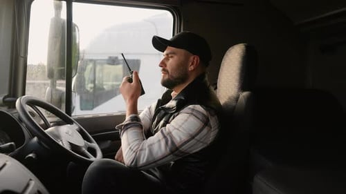 Truck Driver Communicating Using a Cb Radio in Right Hand Drive Car